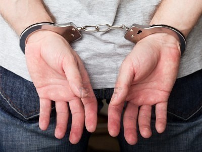8862454-police-law-steel-handcuffs-arrest-crime-human-hand
