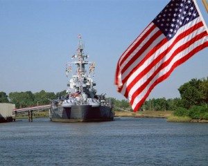 Battleship_and_flag_on_river-web